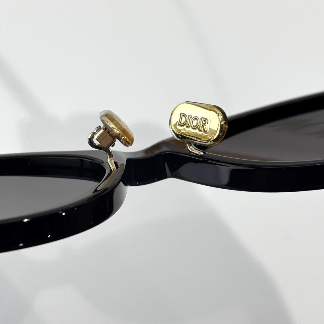D**R Small Oval Sunglasses | Gloss Black Acetate Frame, Crystal-Set DIOR Letter Temple Block, Gold Metal Nose Bridge, Flat Grey Lenses