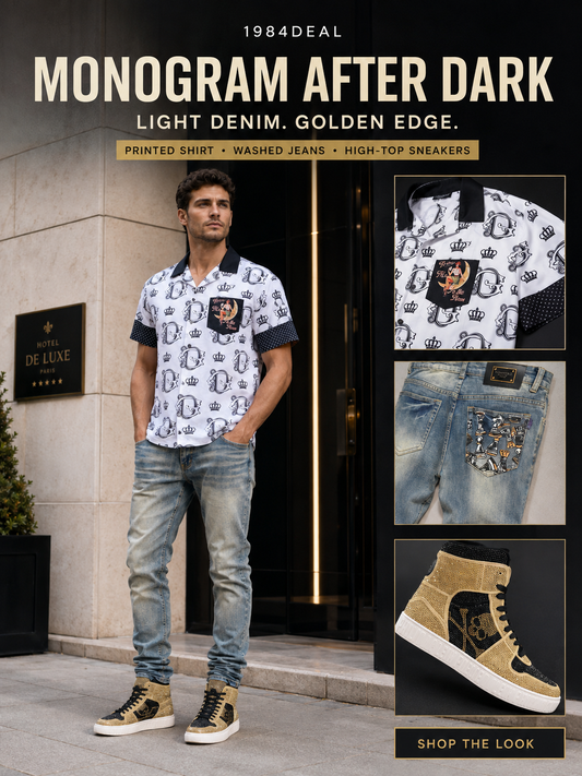 Man wearing a white monogram crown-print short-sleeve shirt, light wash slim jeans with embellished hardware, and gold black high-top studded sneakers outside a luxury hotel