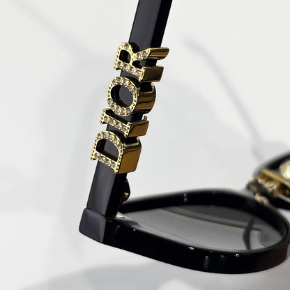 D**R Oval Cat-Eye Sunglasses | Gloss Black Acetate Frame, 3D DIOR Letter Hinge Block, Gold Metal Nose Bridge, Flat Grey Lenses
