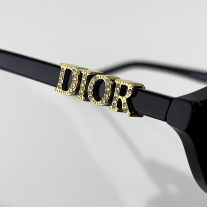D**R Oval Cat-Eye Sunglasses | Gloss Black Acetate Frame, 3D DIOR Letter Hinge Block, Gold Metal Nose Bridge, Flat Grey Lenses
