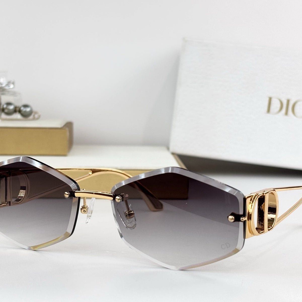 D**R 30Montaigne S6U Rimless Sunglasses | Gold Metal Frame, Brown Gradient Bevelled Lenses, CD Logo Temple | Multiple Colors
